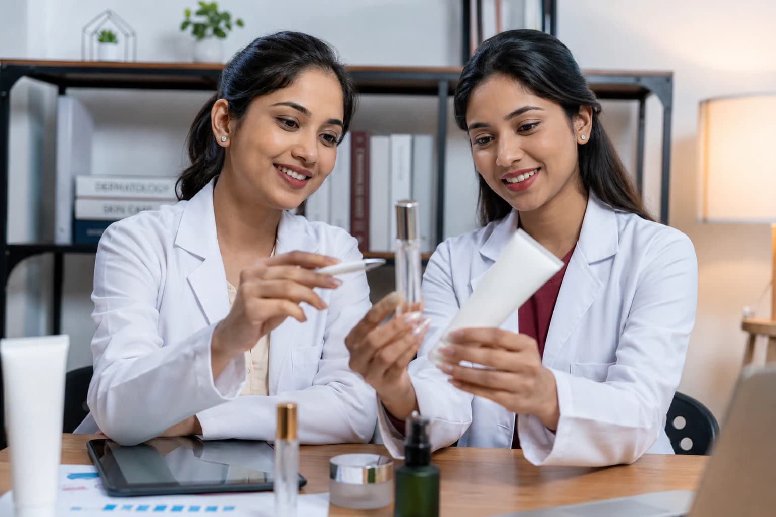 Skin care professionals reviewing a private-label product sample